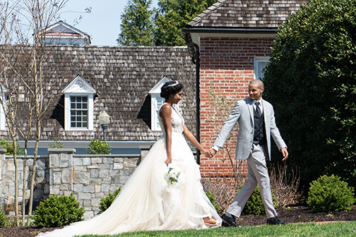 bride and groom walking to Kentlands Mansion